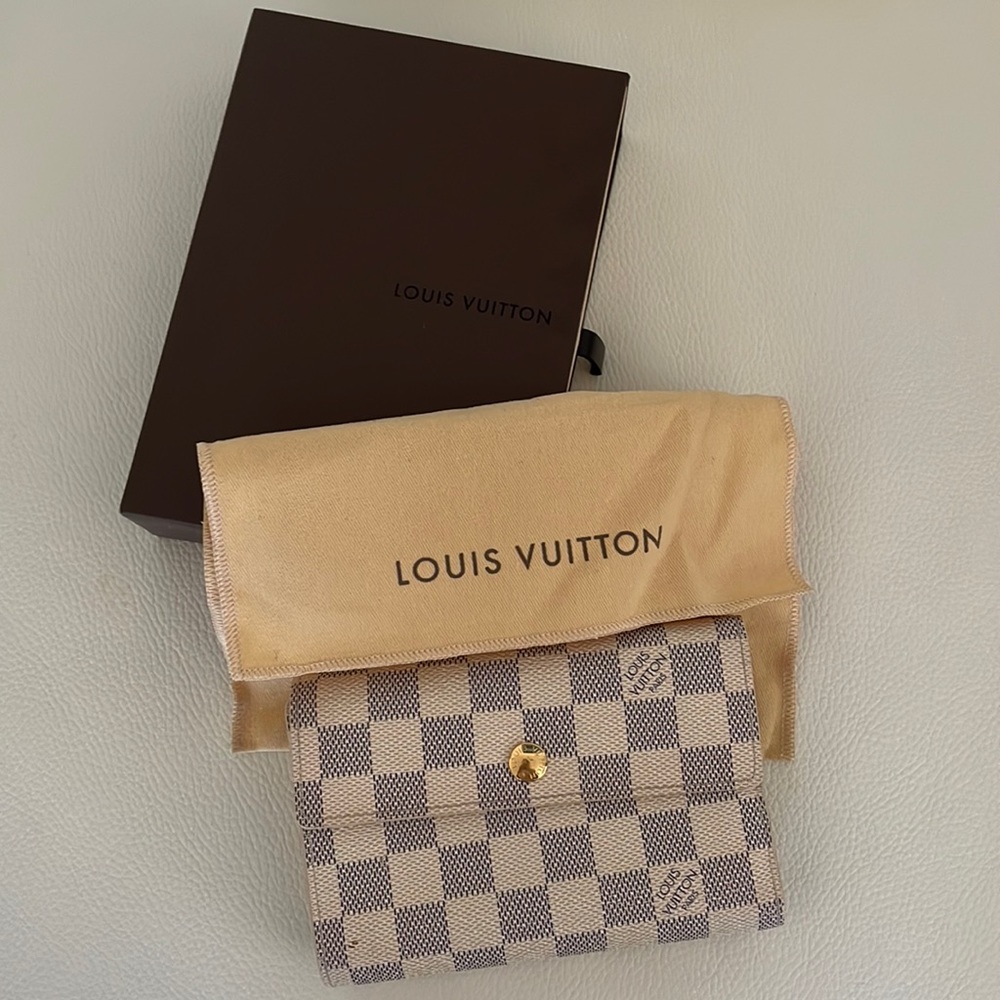 Authentic Damier Azur coated canvas zip coin pocket, bill pocket, 13 card slots.